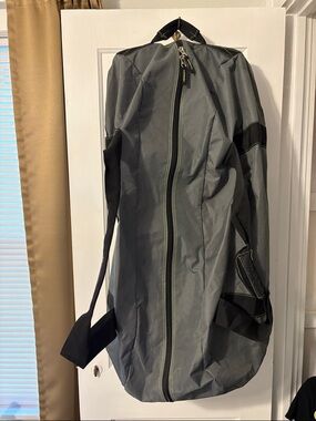 Gray Duffel Bag with Black Backpack Straps and Wheels